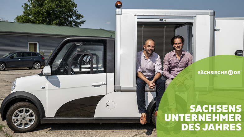 Gründer Thomas Kuwatsch und Geschäftsführer Daniel Jacob sitzen in einem ARI 458 mit Kofferaufbau.