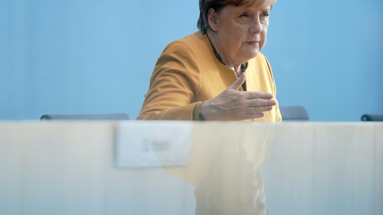 Merkel: Einschränkungen als Wellenbrecher