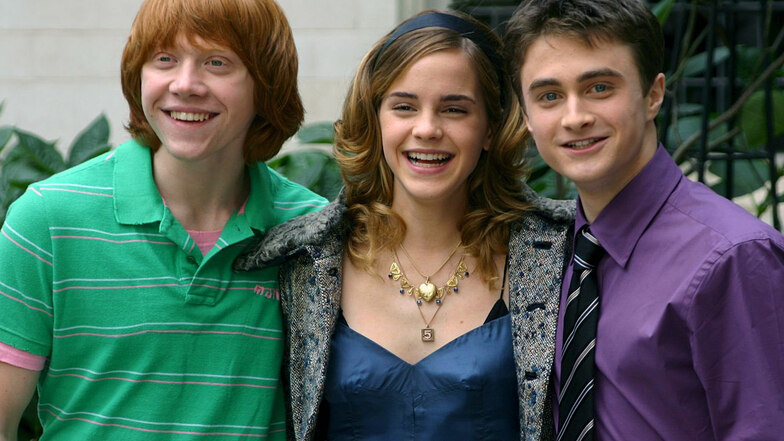 Rupert Grint (links) mit Emma Watson  und Daniel Radcliffe  im Jahr 2005.
