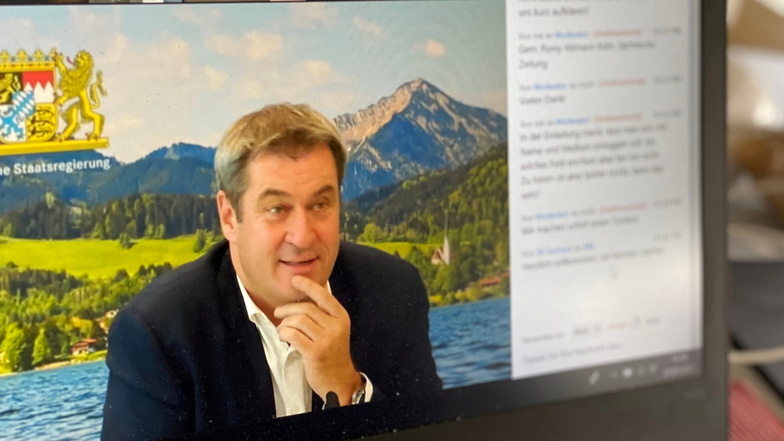 Markus Söder schaltete sich aus Bayern zu. Im Hintergrund hatte er ein Bild vom Tegernsee eingestellt. "Das ist unser Teich", kommentierte er.