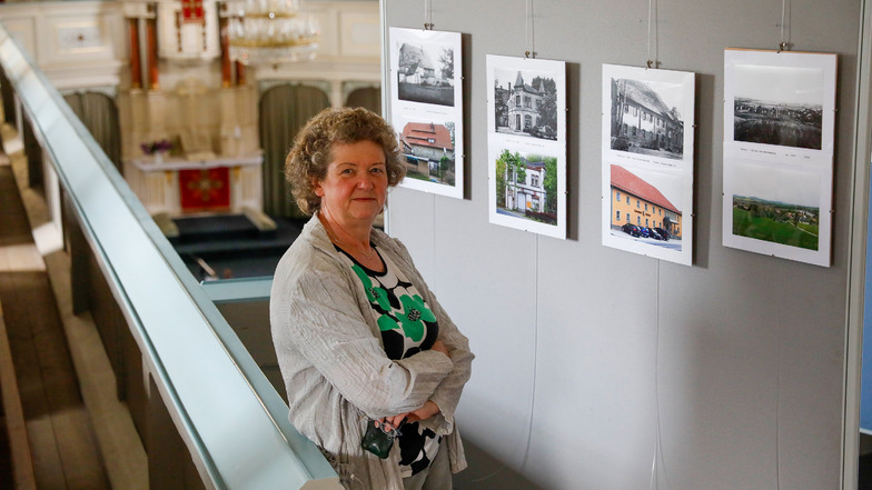 Viola Streubel vom Förderverein der Walddorfer Kirche zeigt die neue Sonderschau mit historischen und aktuellen Aufnahmen aus dem Ort.