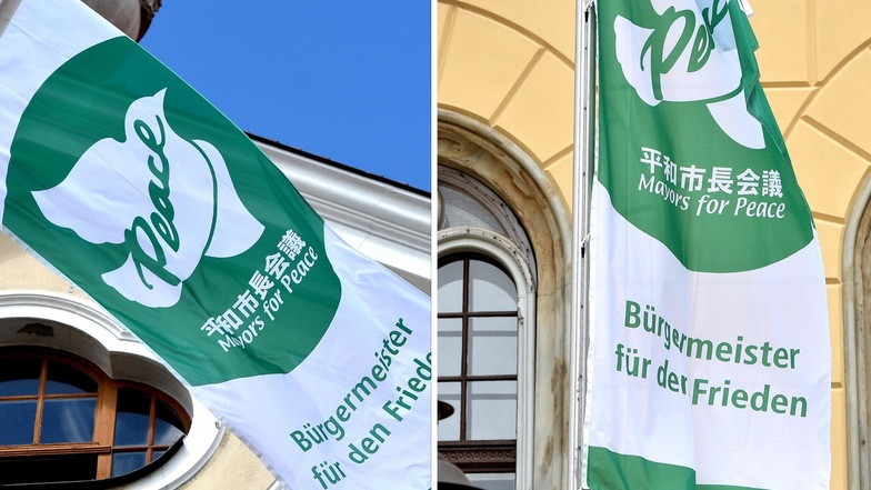 Eine weiße Taube vor grünem Hintergrund: Vor den Rathäusern in Löbau und Zittau haben am Montag die Flaggen geweht.