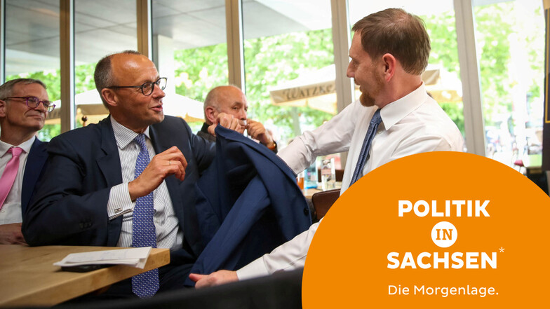 Friedrich Merz und Michael Kretschmer bei einem gemeinsamen Wahlkampfauftritt in Dresden. Jetzt stehen beide im Zentrum einer Debatte über den Umgang mit der AfD.