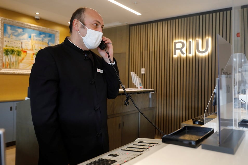 A receptionist speaks on the phone at the Hotel Riu Festival in Palma de Mallorca.